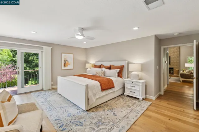 a spacious bedroom with a bed and a large window