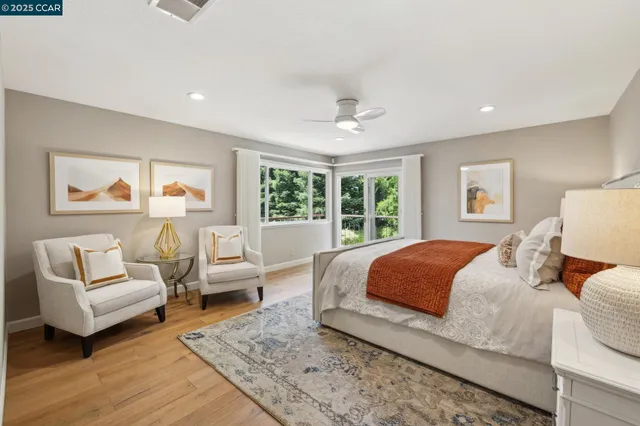 a bedroom with a large bed and a couch