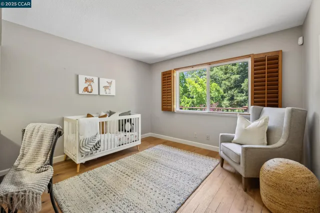 a bed room with furniture and a window