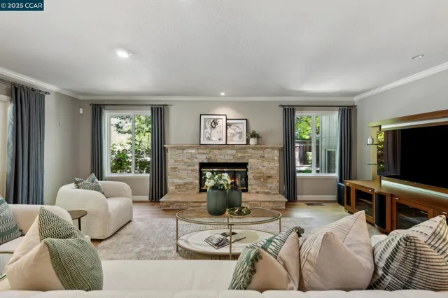 a living room with furniture and a fireplace