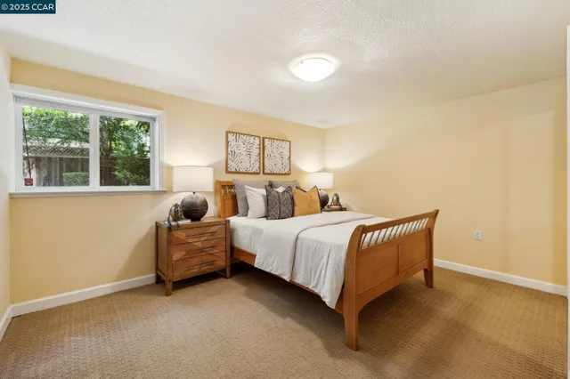 a bedroom with a bed and a couch