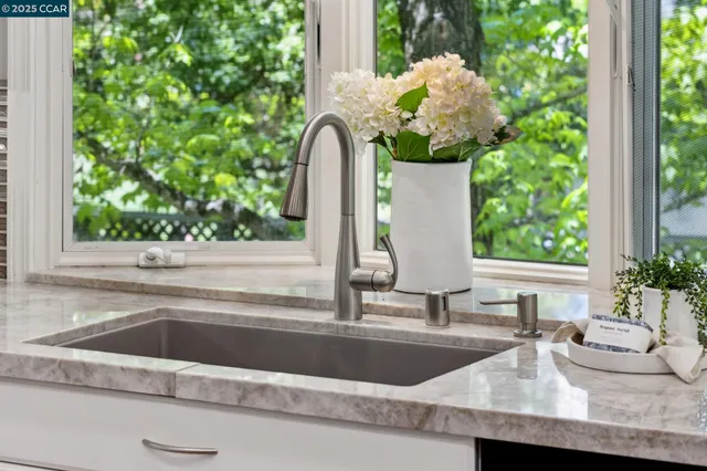 a kitchen with a sink and window