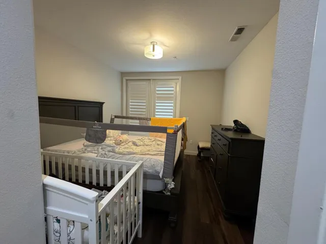 a bedroom with furniture and a window