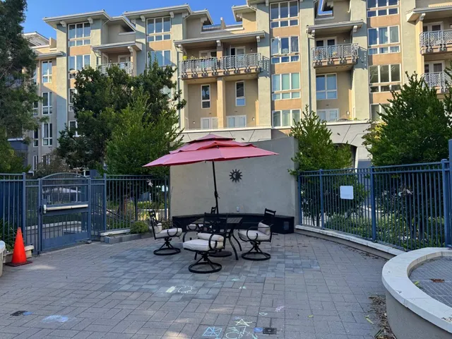 a view of a chairs and table in the patio
