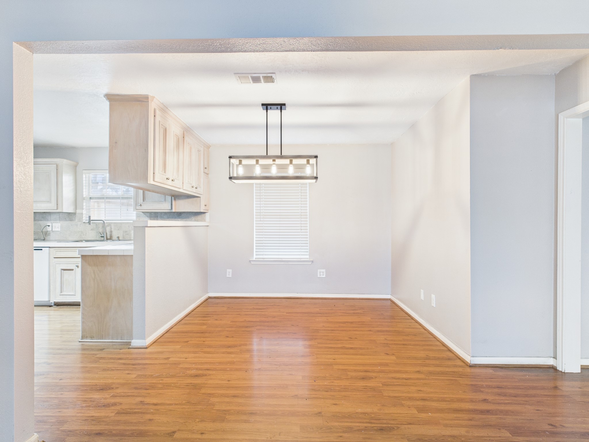 10130 Sussex Lane Houston, TX 77041 - Photo 7 of 20 a view of cabinets and wooden floor