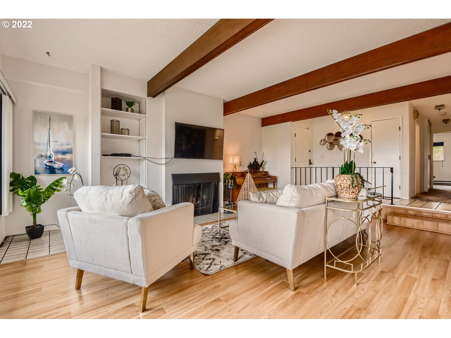 1503 Southwest Hall Street Portland, OR 97201 - Photo 5 of 17 a living room with furniture a flat screen tv and a fireplace