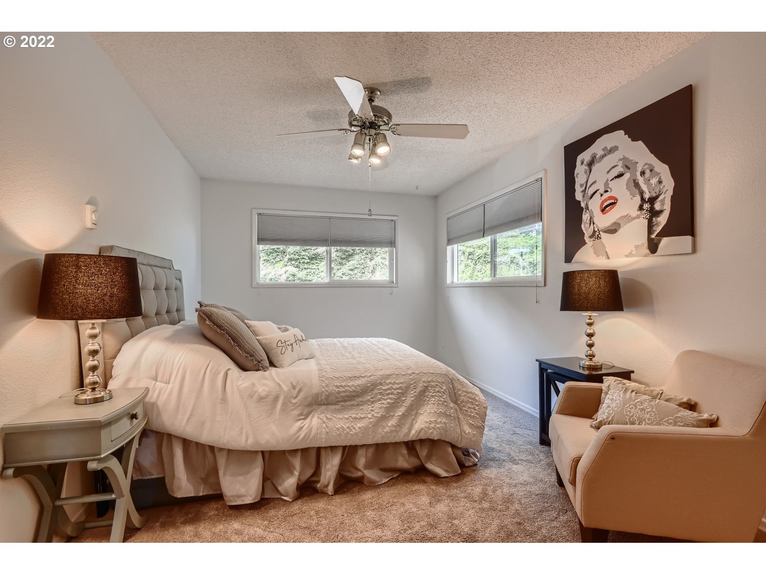1503 Southwest Hall Street Portland, OR 97201 - Photo 10 of 17 a bedroom with a bed and a lamp on dresser