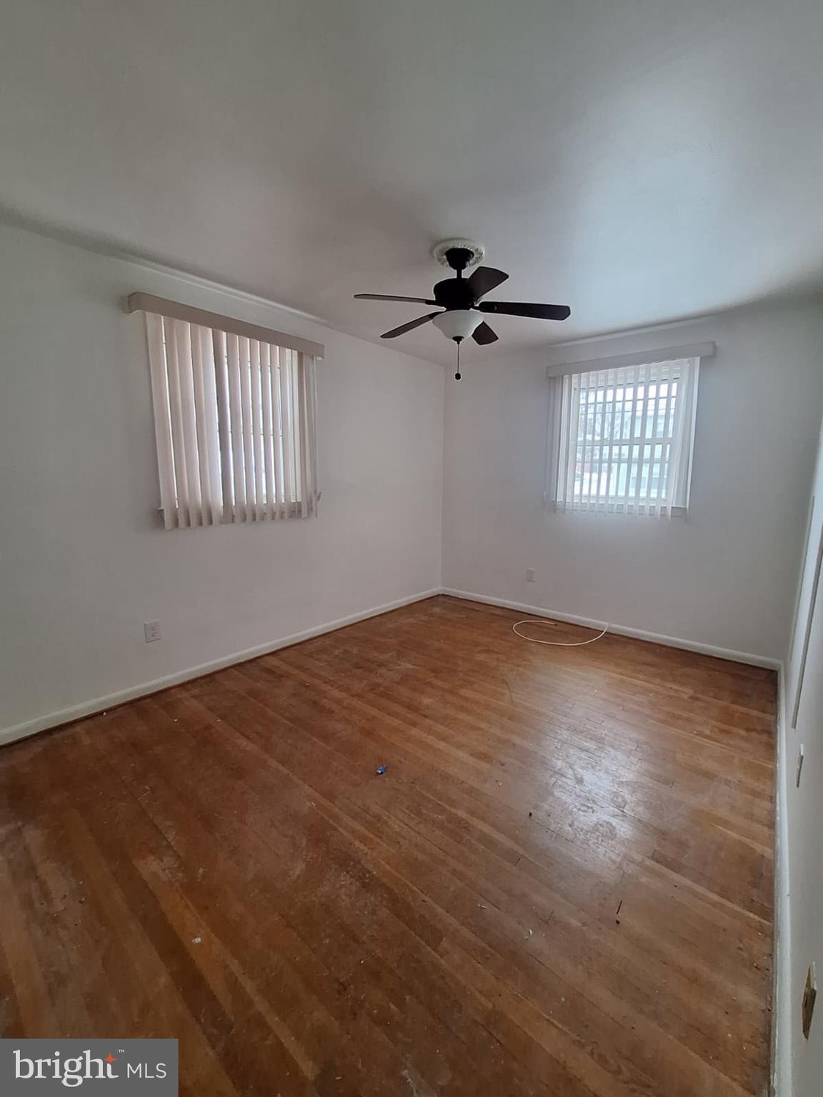 7910 Subet Road Baltimore, MD 21244 - Photo 2 of 8 a view of empty room with windows