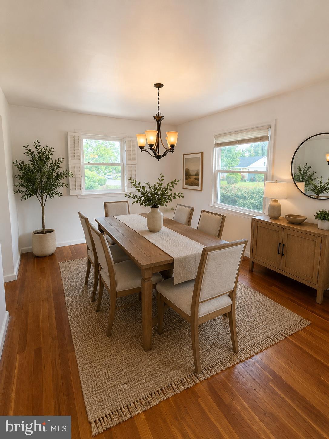 7910 Subet Road Baltimore, MD 21244 - Photo 7 of 8 a dining room with furniture window and wooden floor