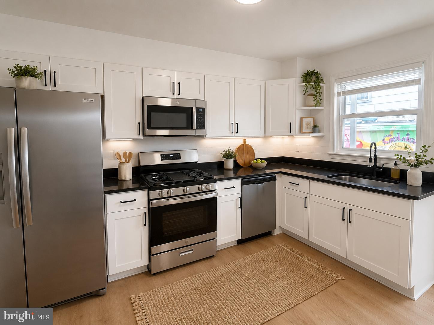 7910 Subet Road Baltimore, MD 21244 - Photo 8 of 8 a kitchen with a sink stove and refrigerator