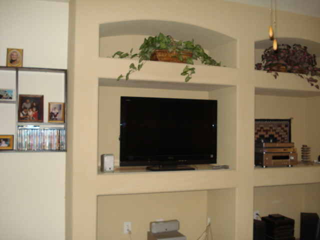 29062 North Mountain View Road San Tan Valley, AZ 85143 - Photo 6 of 15 a living room with furniture a flat screen tv and a fireplace