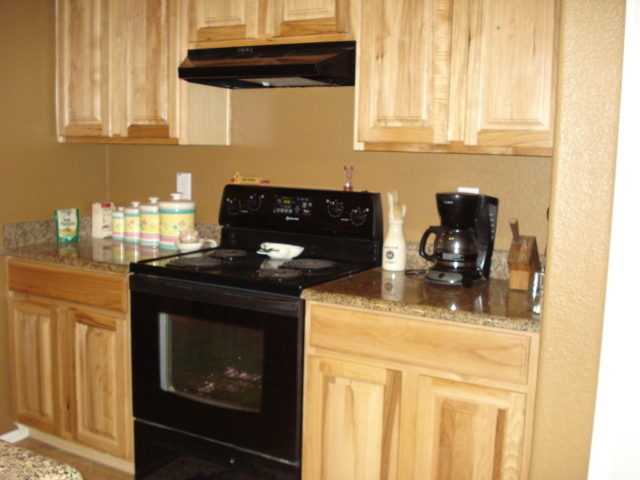 29062 North Mountain View Road San Tan Valley, AZ 85143 - Photo 8 of 15 a kitchen with a stove and cabinets