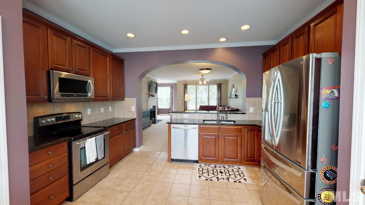 The kitchen is large and has lots of cabinets as well as a pantry!