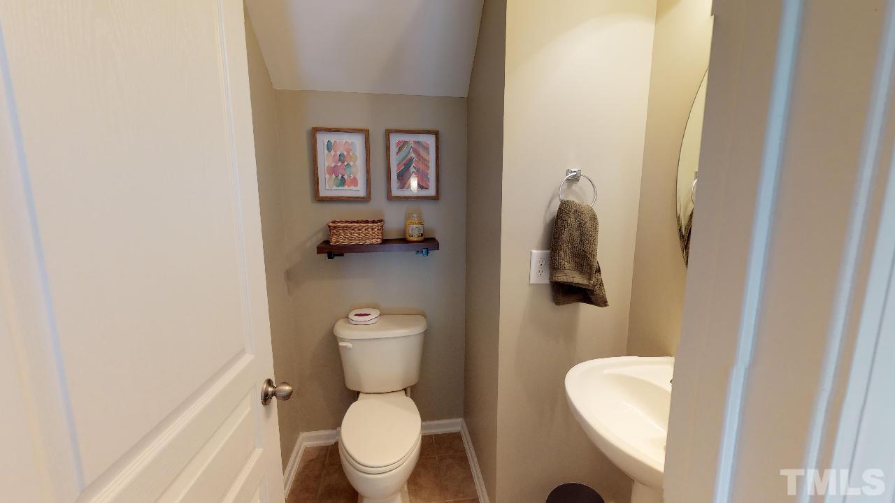 5706 Cameo Glass Way Raleigh, NC 27612 - Photo 11 of 21 The second floor main living area has a half bath!