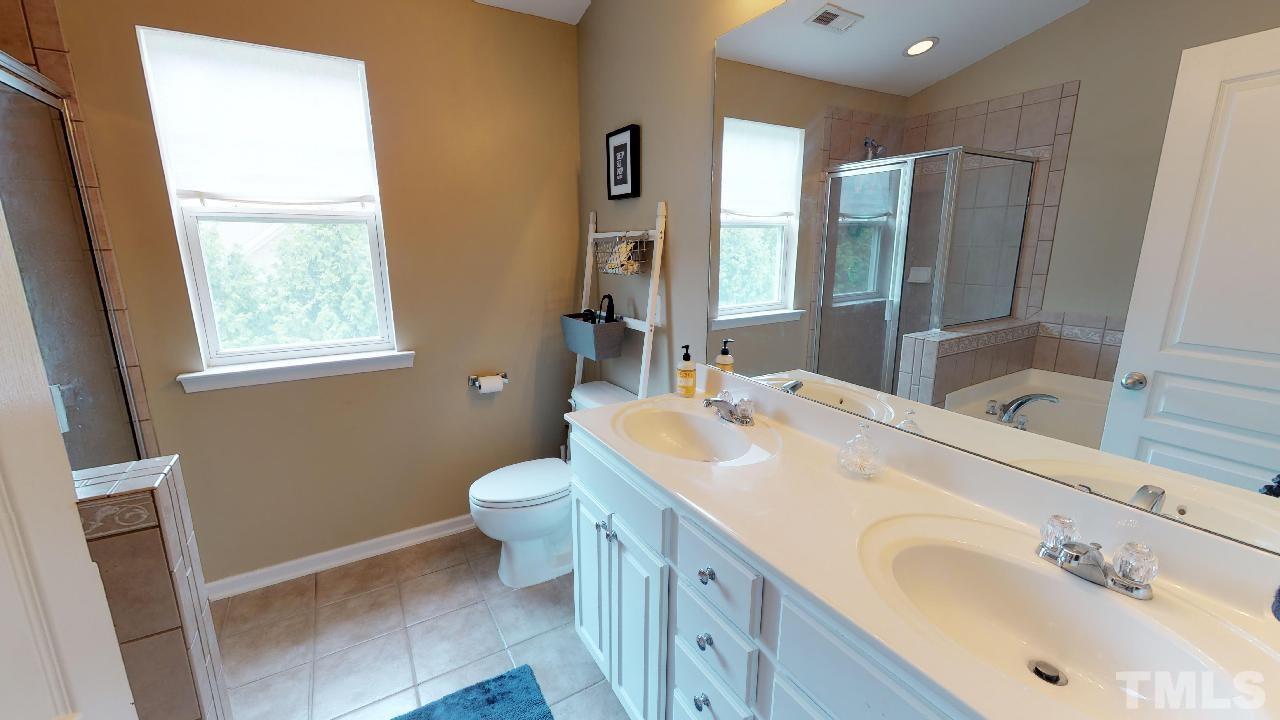 5706 Cameo Glass Way Raleigh, NC 27612 - Photo 15 of 21 This large master bath has a separate tub and shower as well as dual vanities!