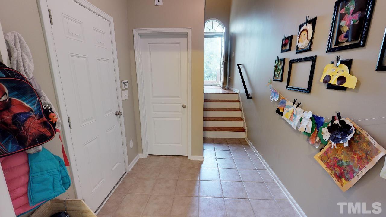 5706 Cameo Glass Way Raleigh, NC 27612 - Photo 6 of 21 As soon as you walk in from the garage, there is a closet conveniently located in the lower foyer!