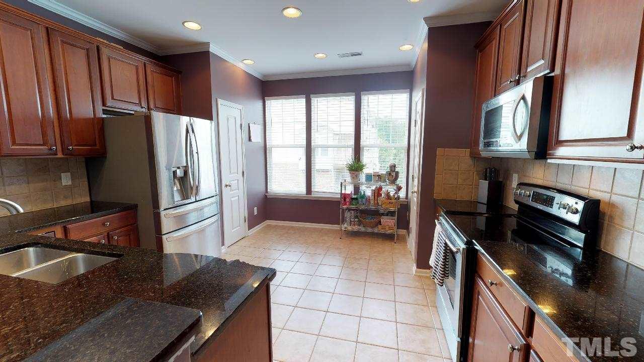 5706 Cameo Glass Way Raleigh, NC 27612 - Photo 8 of 21 Gourmet kitchen with granite and stainless steel appliances!