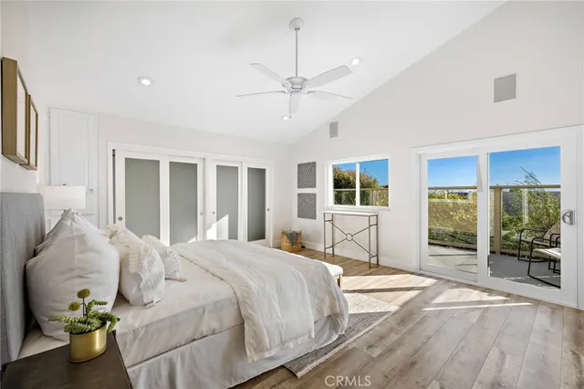 a spacious bedroom with a bed and a view of bedroom