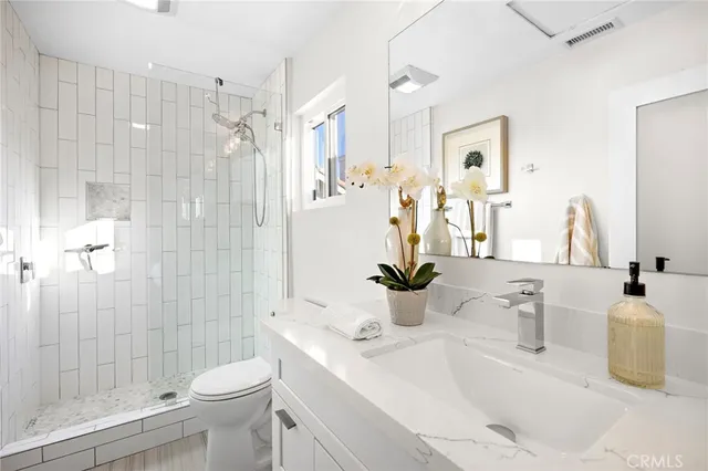 a view of a patio with table and chairs and potted plants