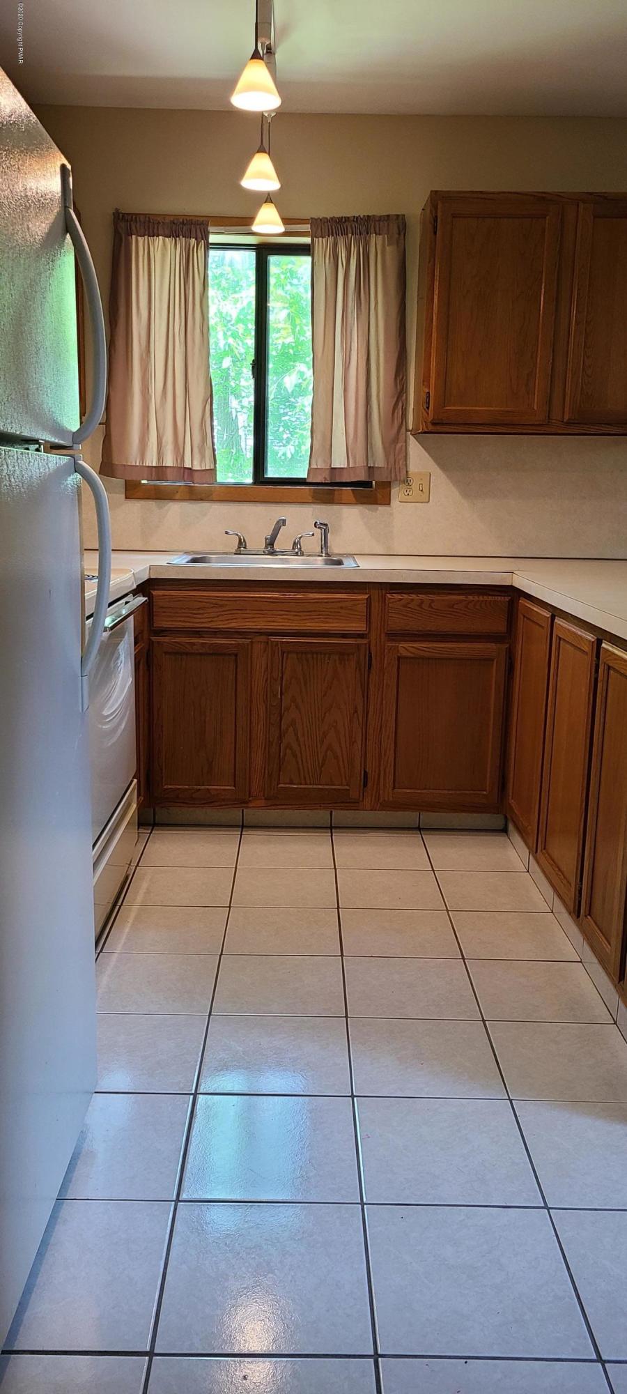 3359 Oberon Road Tobyhanna, PA 18466 - Photo 6 of 22 a kitchen with a cabinets and window