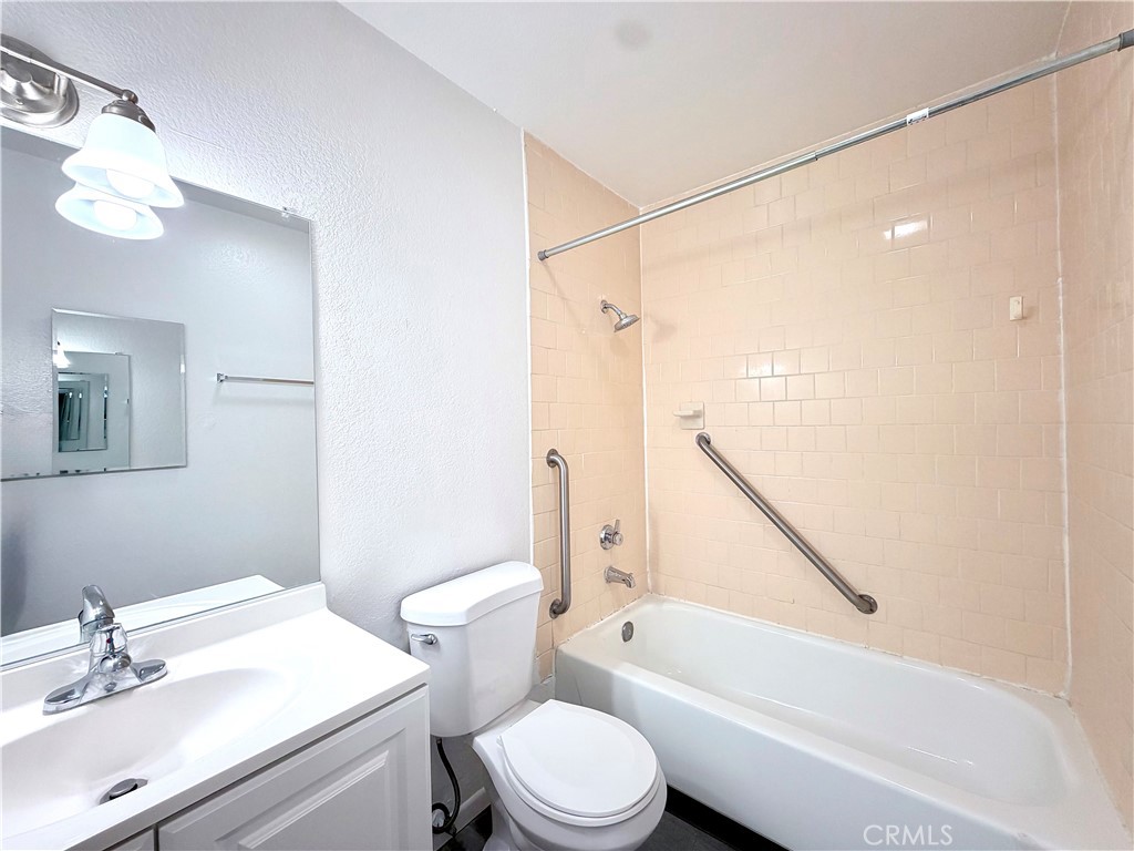 4056 Bemis Street, Unit 1 Los Angeles, CA 90039 - Photo 5 of 5 a bathroom with a bathtub shower sink vanity mirror and toilet