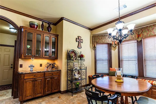 a very nice looking dining room with a table and chairs