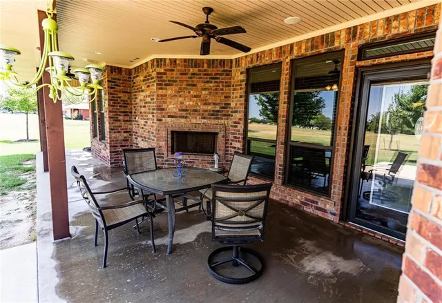 a view of a patio with a table and chairs