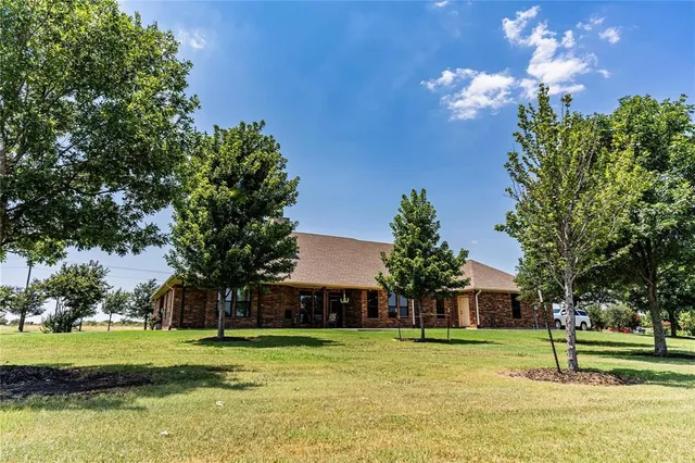 a house view with a garden space