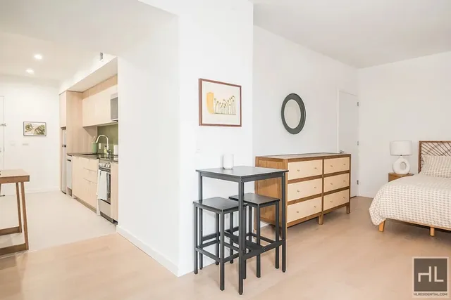 a bedroom with a bed and furniture