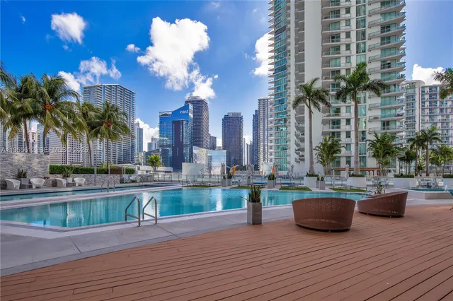 a view of a swimming pool with lounge chair