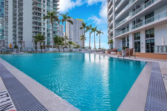 a view of swimming pool with outdoor seating