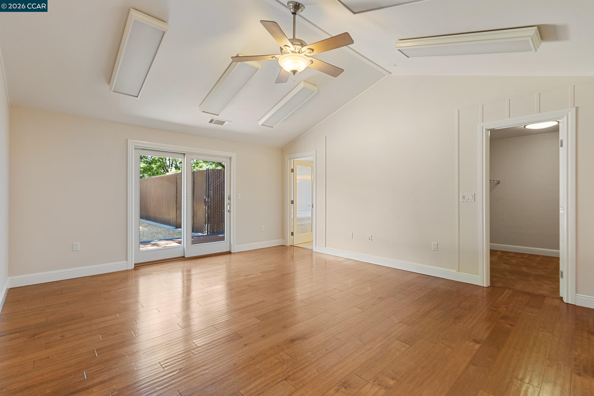 484 Diablo Road Danville, CA 94526 - Photo 38 of 39 an empty room with wooden floor and a ceiling fan