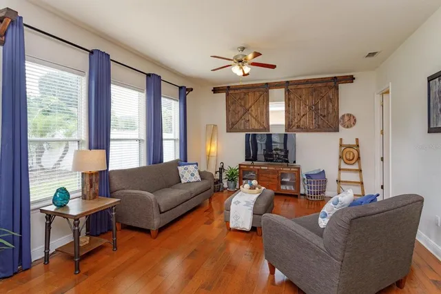 a living room with furniture and a large window
