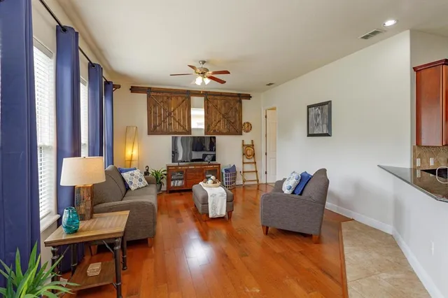 a living room with furniture or couch and a flat screen tv