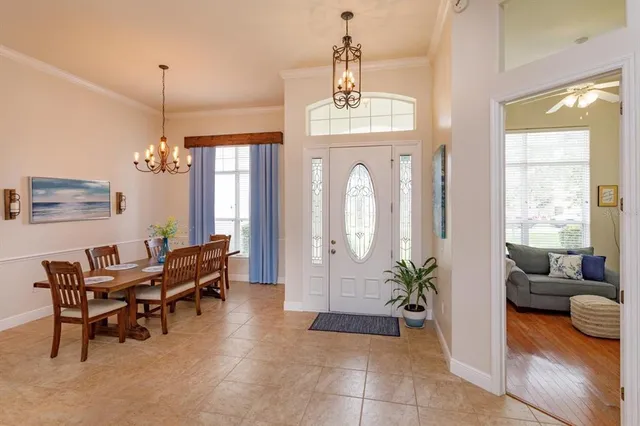 a view of a livingroom with furniture window and wooden floor