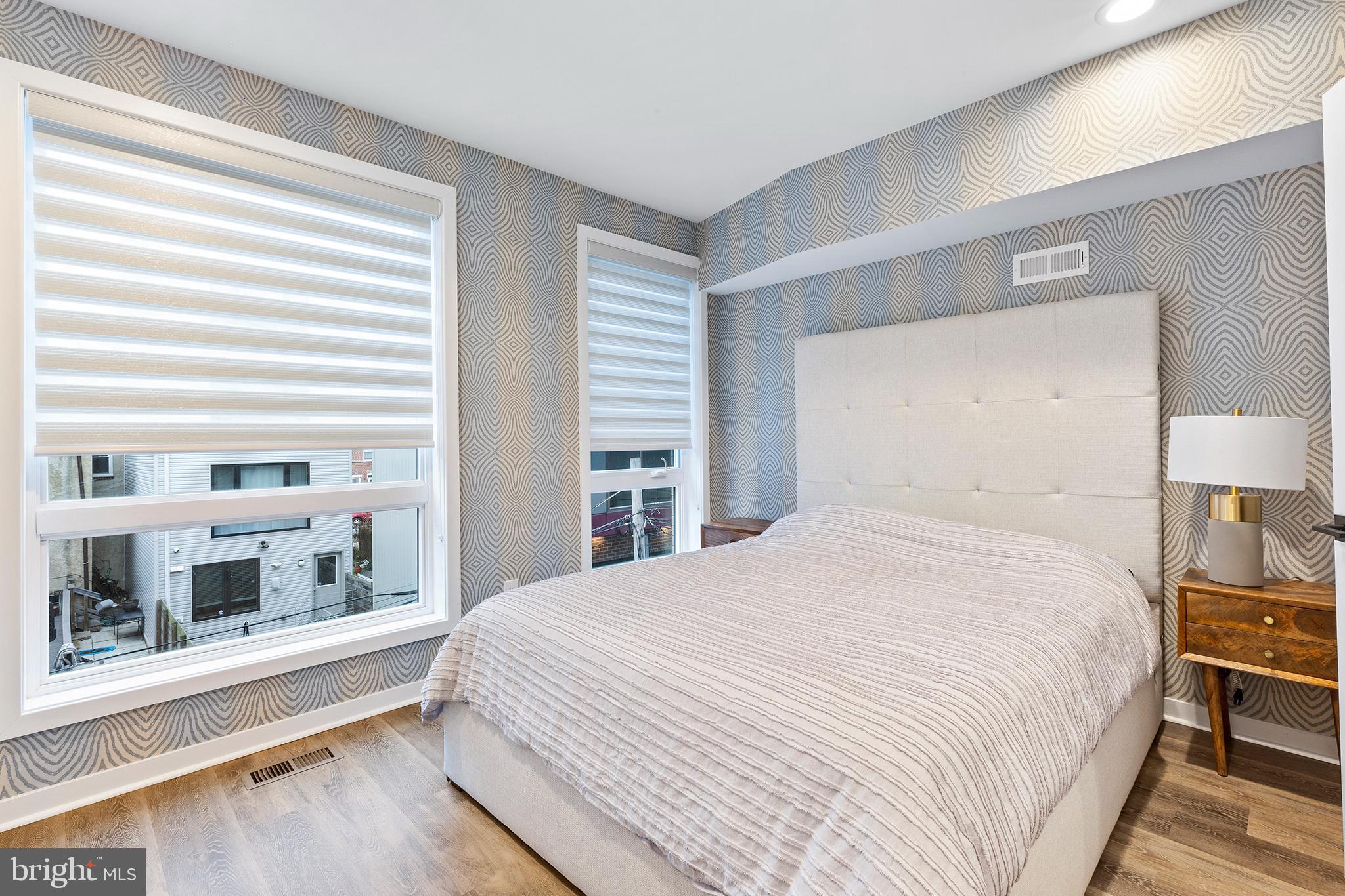 815 Perkiomen Street, Unit 15 Philadelphia, PA 19130 - Photo 11 of 27 a bedroom with a bed and a large window