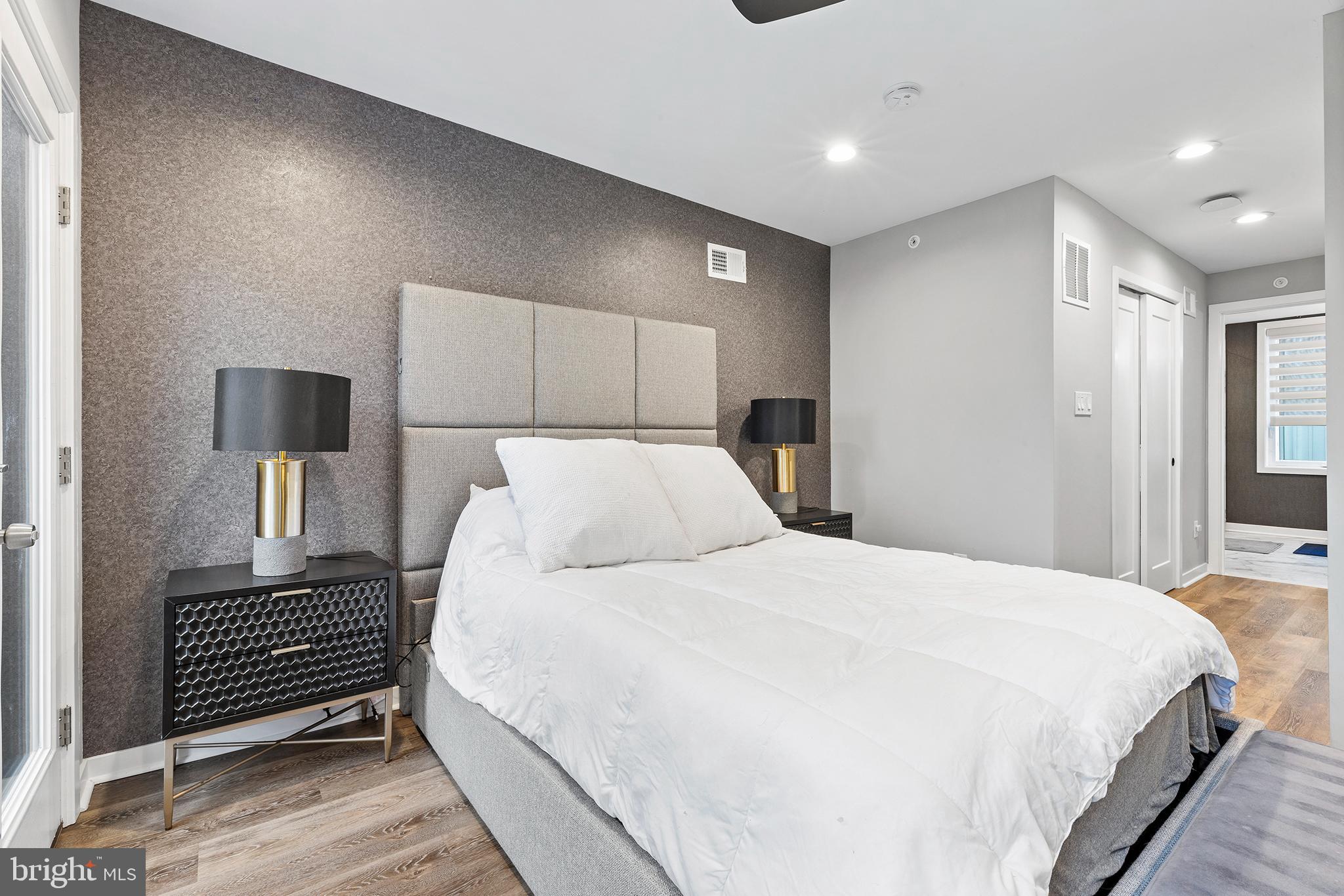 815 Perkiomen Street, Unit 15 Philadelphia, PA 19130 - Photo 17 of 27 a bedroom with a bed and a night stand