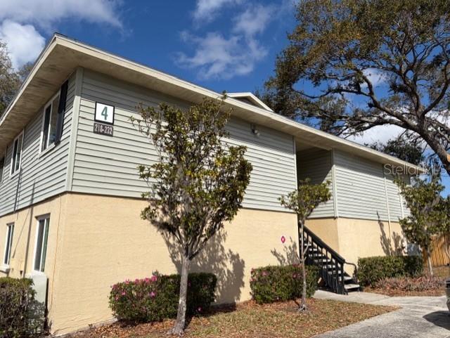 230 Red Cedar Place, Unit 230 Brandon, FL 33510 - Photo 1 of 1 a front view of a house with a tree