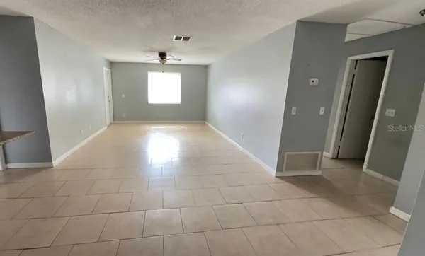 a view of an empty room and window