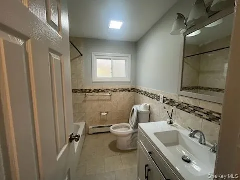 a bathroom with a sink and toilet