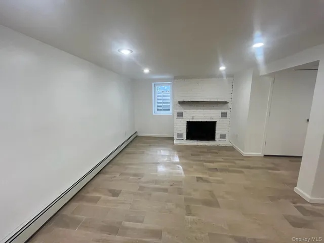 an empty room with fireplace