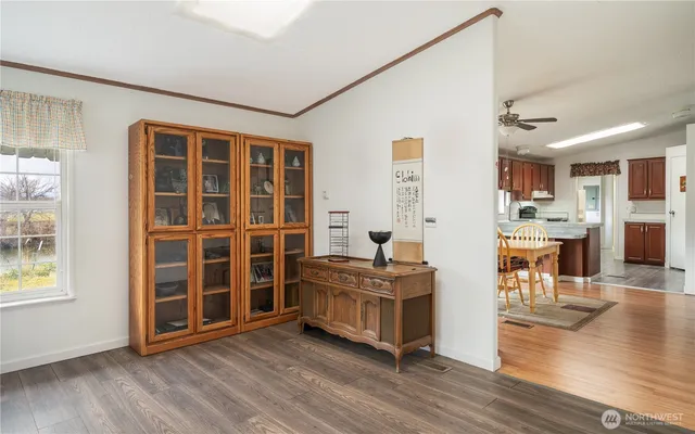 a view of a livingroom with furniture and wooden floor