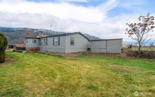 a view of a house with a garden and yard