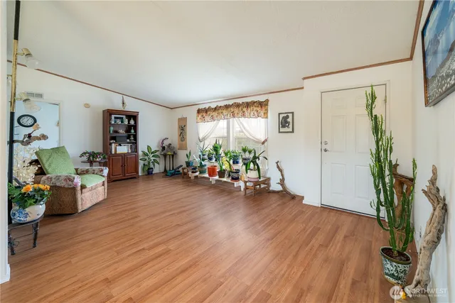 a room with furniture and a wooden floor