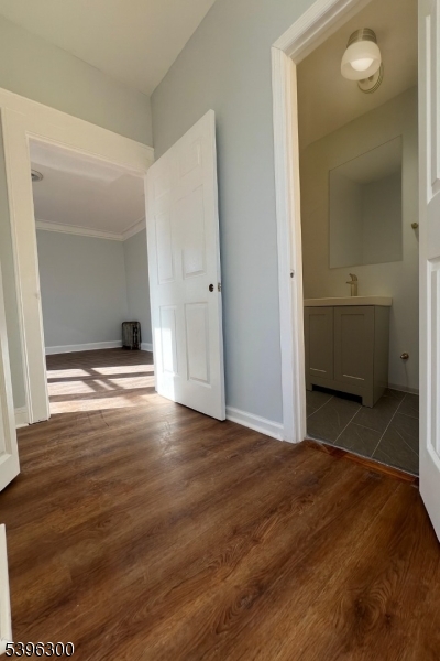 55 Schley Street Newark, NJ 07112 - Photo 7 of 8 a view of a room with wooden floor and bathroom