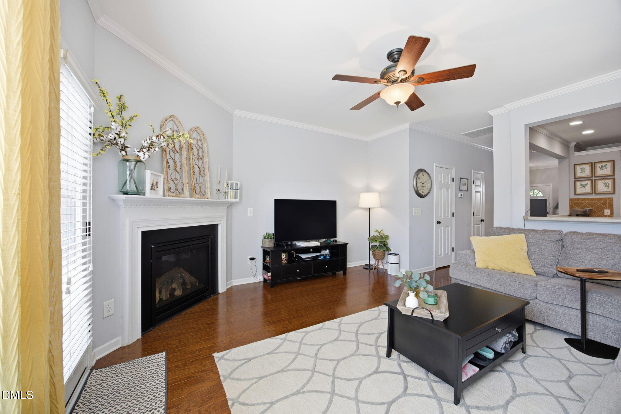 2827 Corbett Grove Drive Raleigh, NC 27616 - Photo 19 of 49 a living room with furniture a fireplace and a flat screen tv