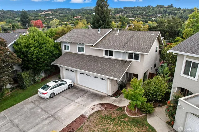 an aerial view of a house with a garden