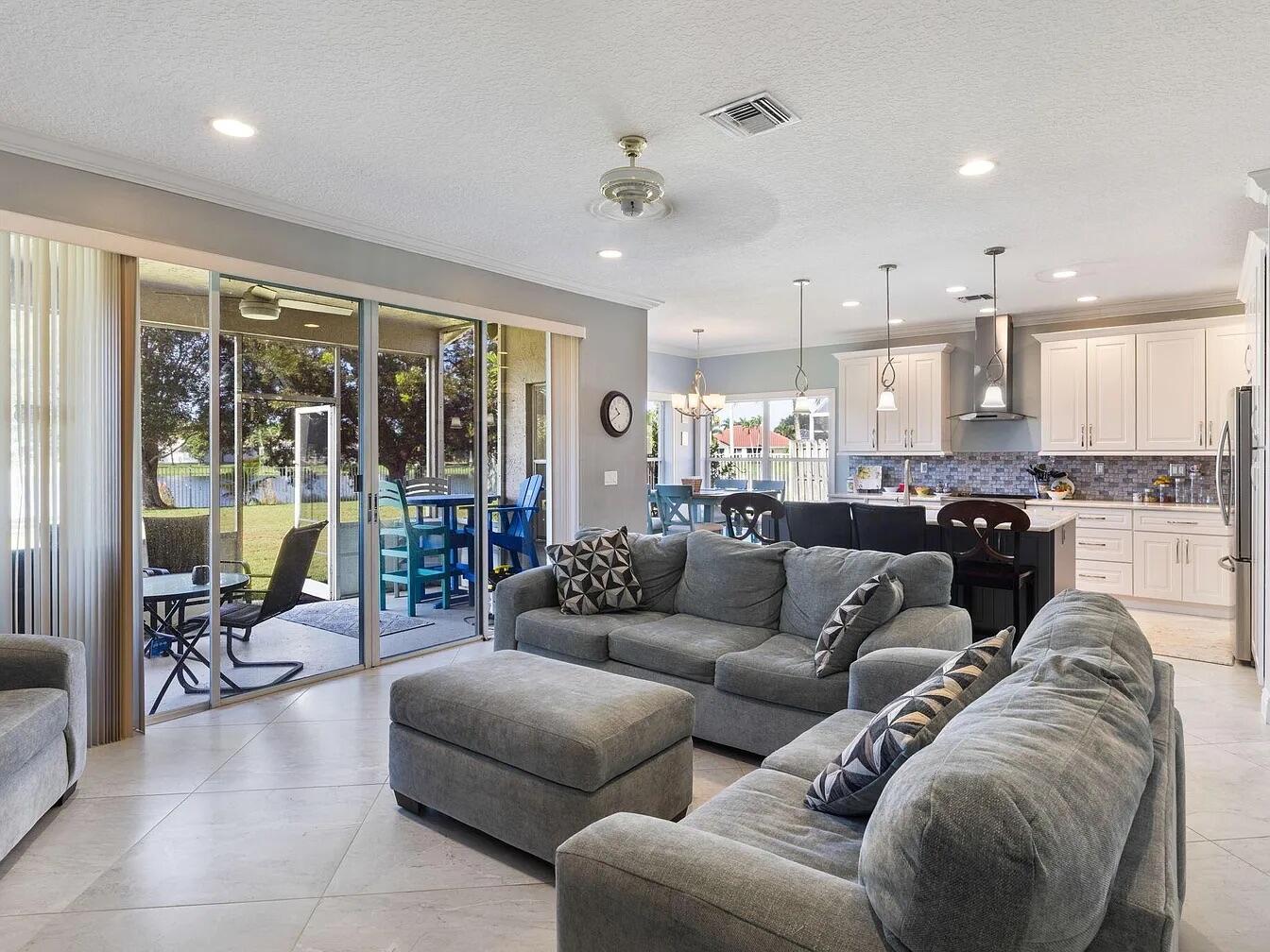 7782 Hoffy Circle Lake Worth, FL 33467 - Photo 13 of 27 a living room with furniture and a large window