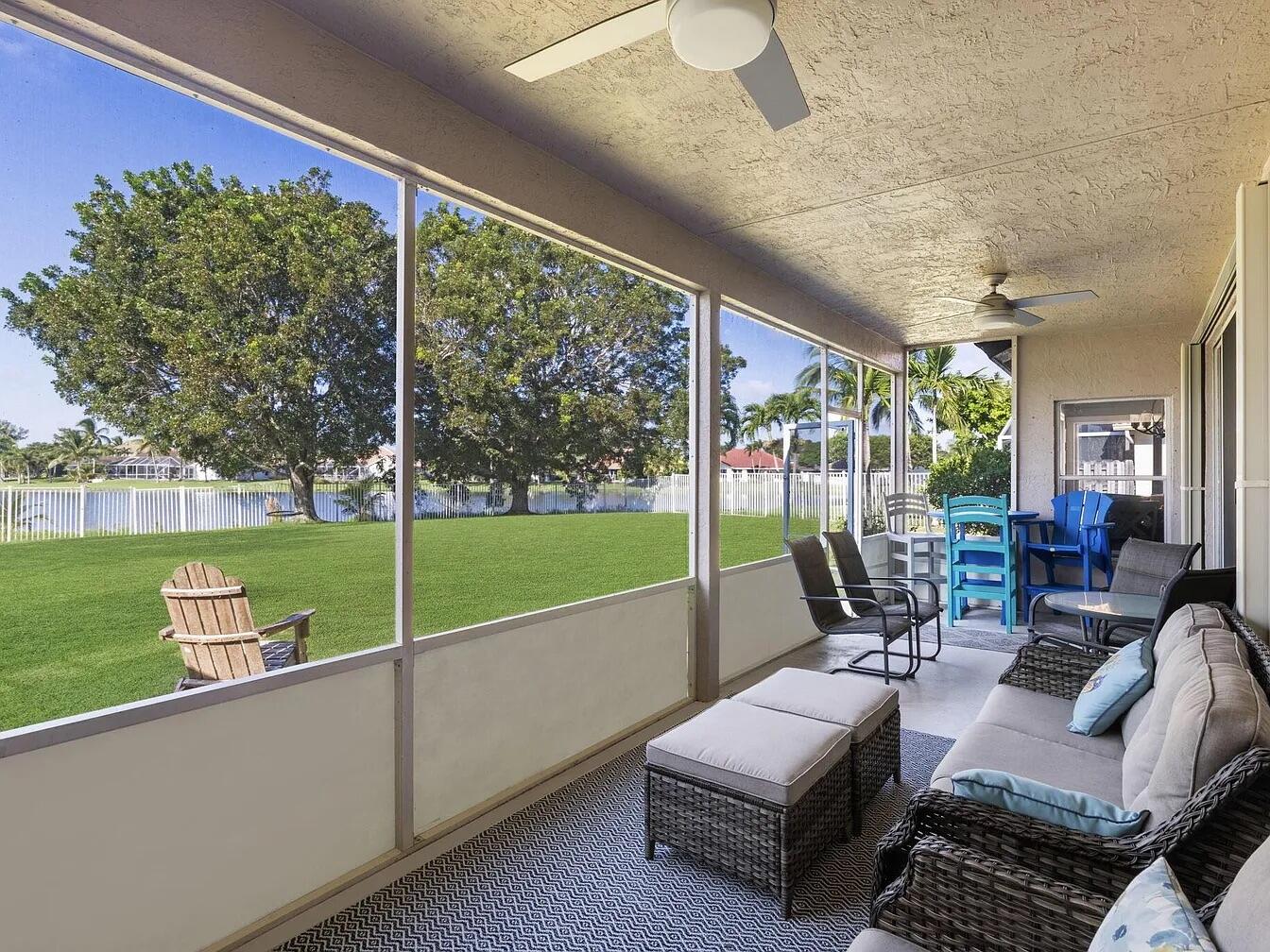 7782 Hoffy Circle Lake Worth, FL 33467 - Photo 14 of 27 a living room with patio furniture and a garden