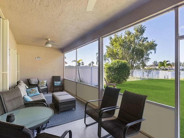 7782 Hoffy Circle Lake Worth, FL 33467 - Photo 15 of 27 a living room with furniture and a garden